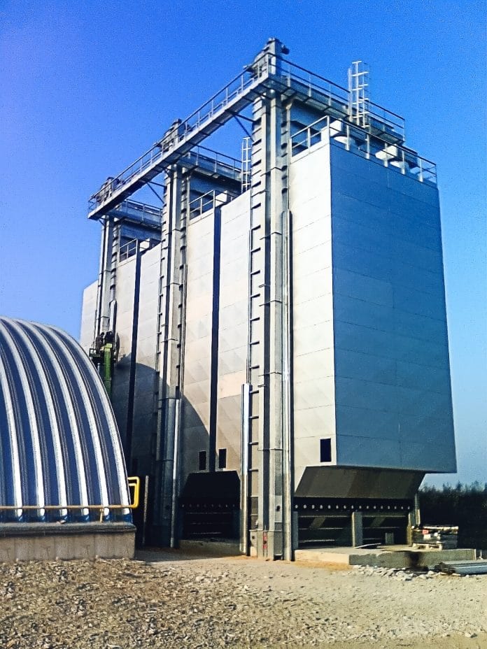 Three recirculating grain dryers together