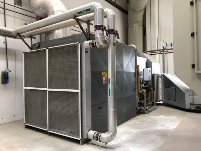 Dryer for industrial sludge with heat exchanger